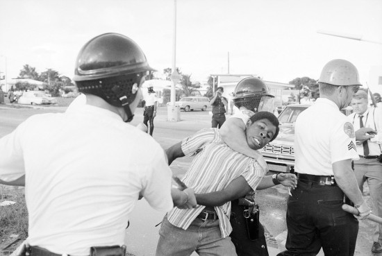 Policemen Choking African American Rioter